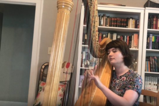 Emily Levin records a solo video to share with hospital patients