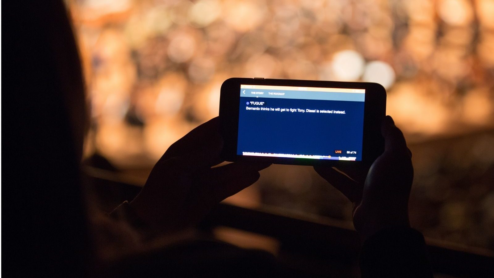 Patron using LiveNote app during a DSO performance