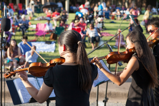 DSO musicians play on an outdoor stage
