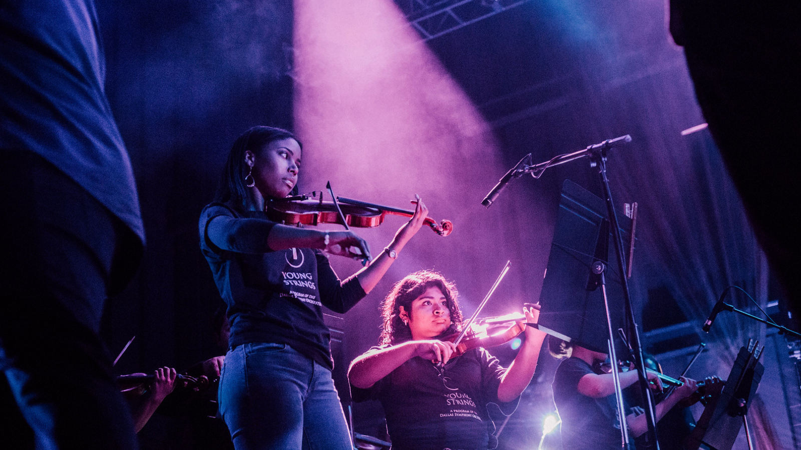 Young strings student play in concert