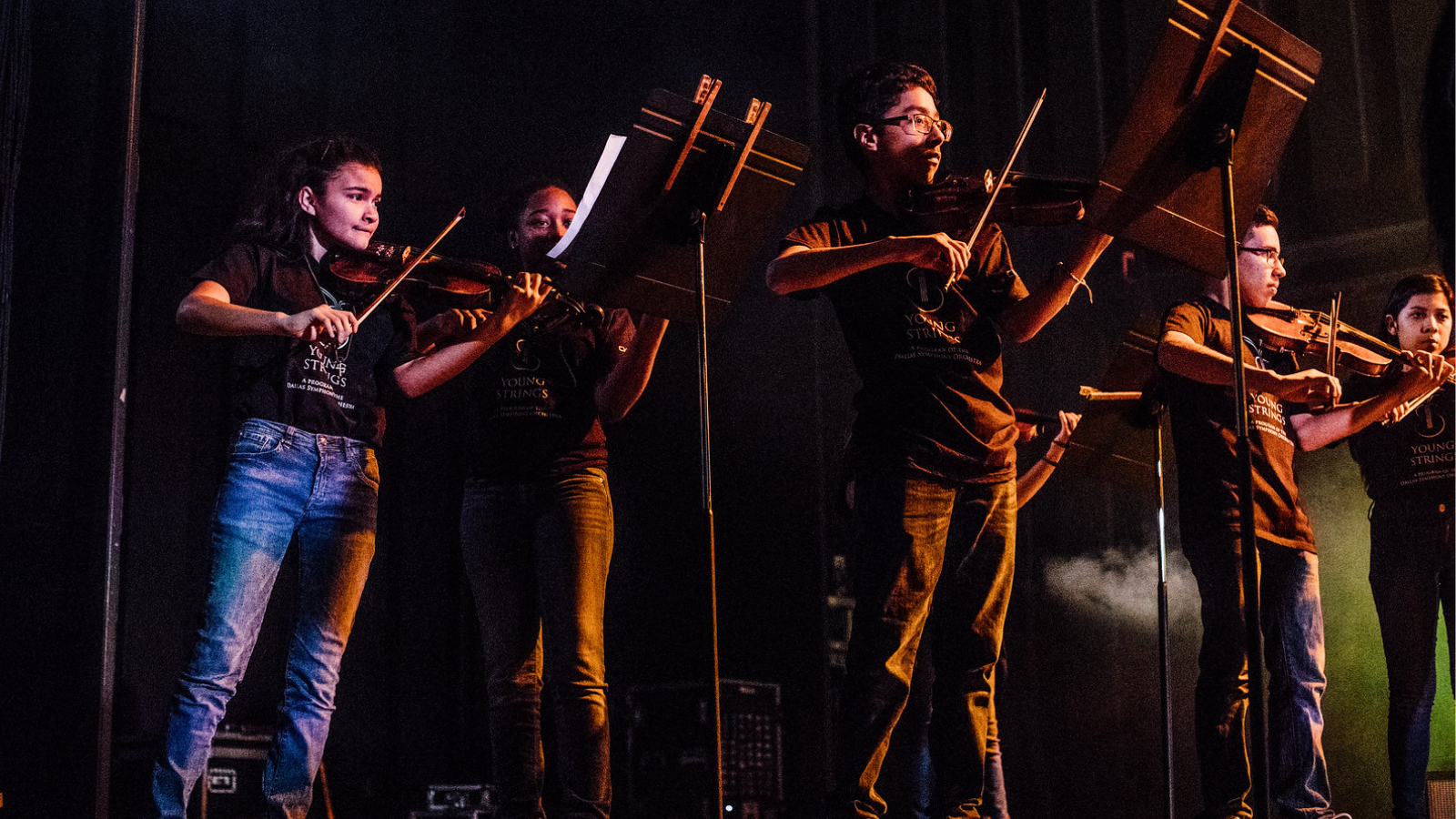 Students perform on stage