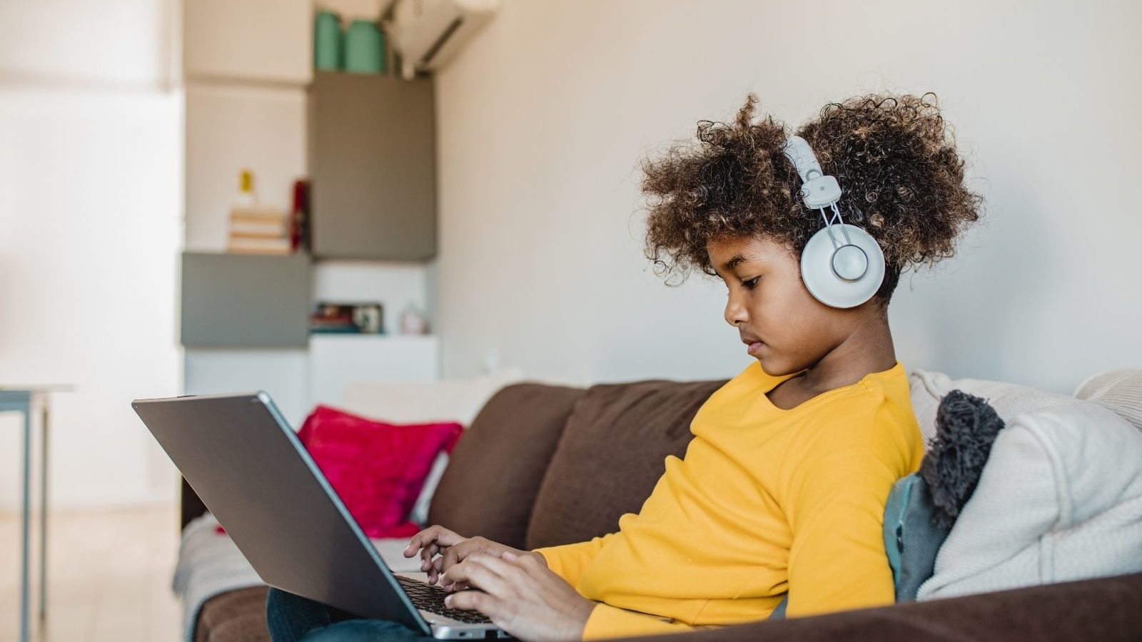 kid watching and listening on his computer