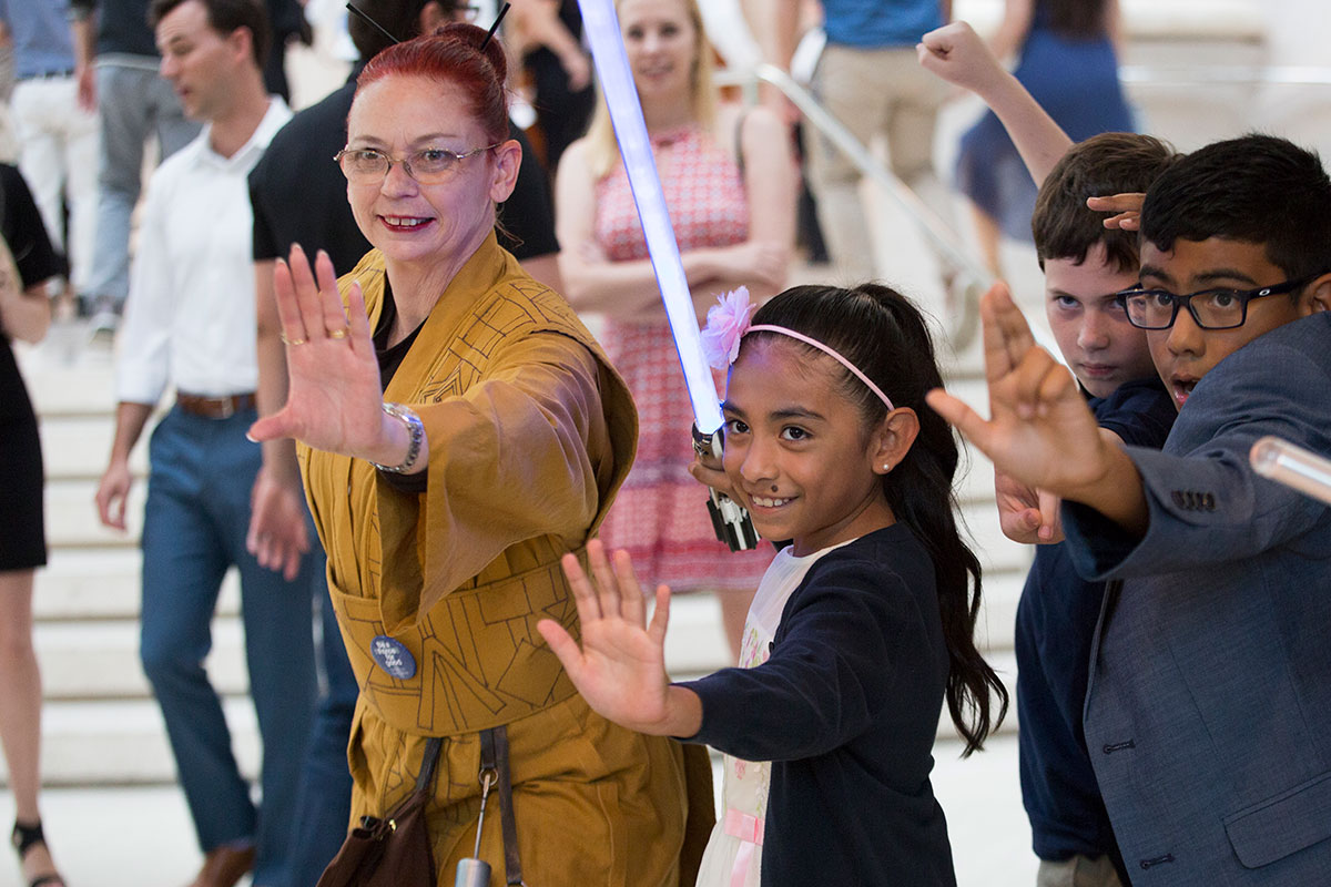 DSO volunteers help with concert activities.