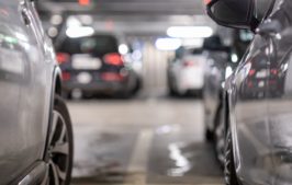 Silver cars in a parking garage