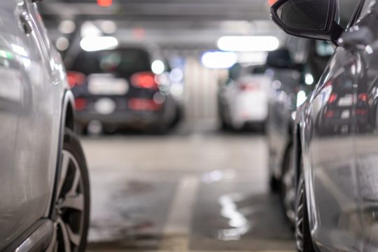 Silver cars in a parking garage