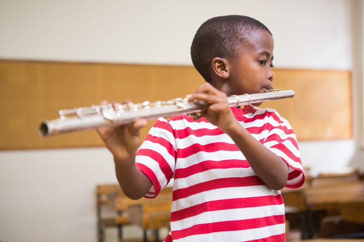 boy playing the flute