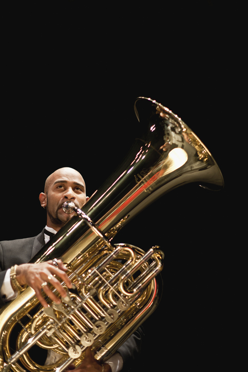 man playing a tuba